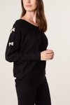 Cassi Pearl Bow V Neck Jumper Black