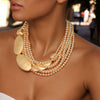 Gold bead and hammer plate necklace